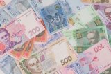 Гривня зміцнилася на закритті міжбанку